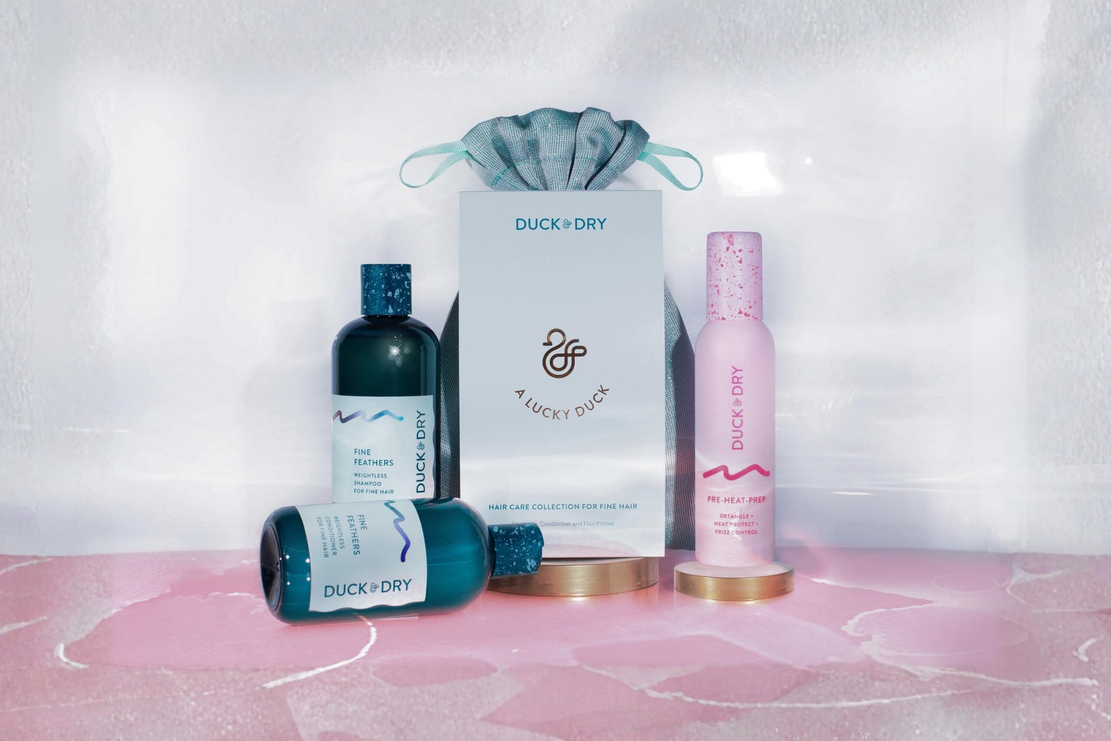 Luxury hair care gift set by Duck & Dry, including shampoo, conditioner, and styling spray for fine hair