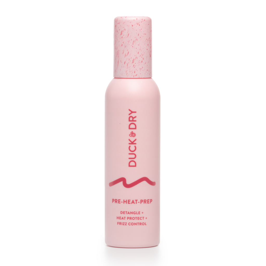Pink bottle of Duck Dry pre-heat prep product on a white background