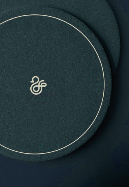 Duck & Dry duck emblem on green textured coasters