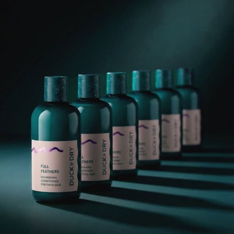 Row of Duck & Dry Full Feathers nourishing conditioner bottles for thick hair