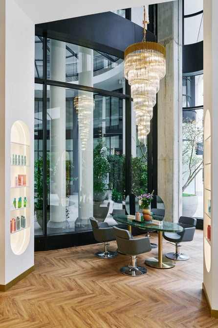 Styling area inside a Duck & Dry salon, with product shelves and floor-to-ceiling windows