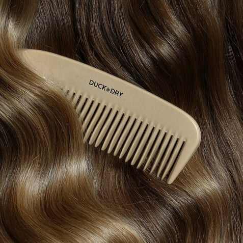 Duck & Dry hair comb shown on softly waved brown hair